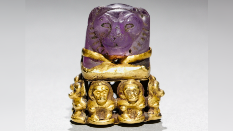 The Lion Carved From Amethyst With Baboons at Its Base